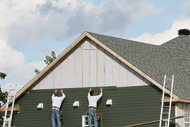 Professional Siding Replacement technician working in Bay Shore, NY